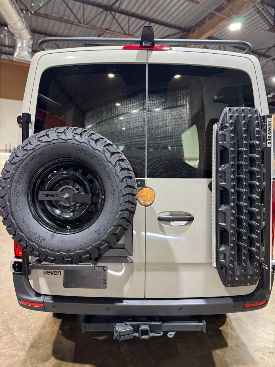 Back view of a vehicle with a spare tire mounted on the back